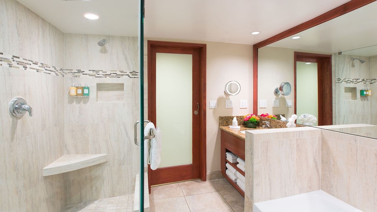 Shower, bathtub and sink in modern bathroom