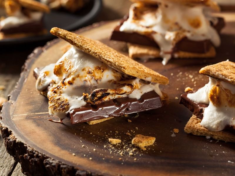 S'mores resting on a stump waiting to be eaten