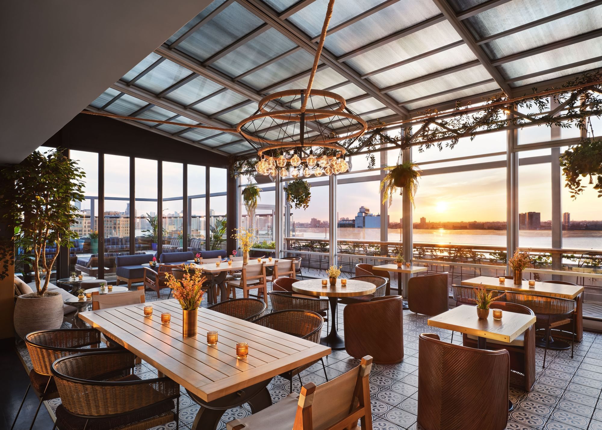 Rooftop bar with sunset and view of the Hudson river