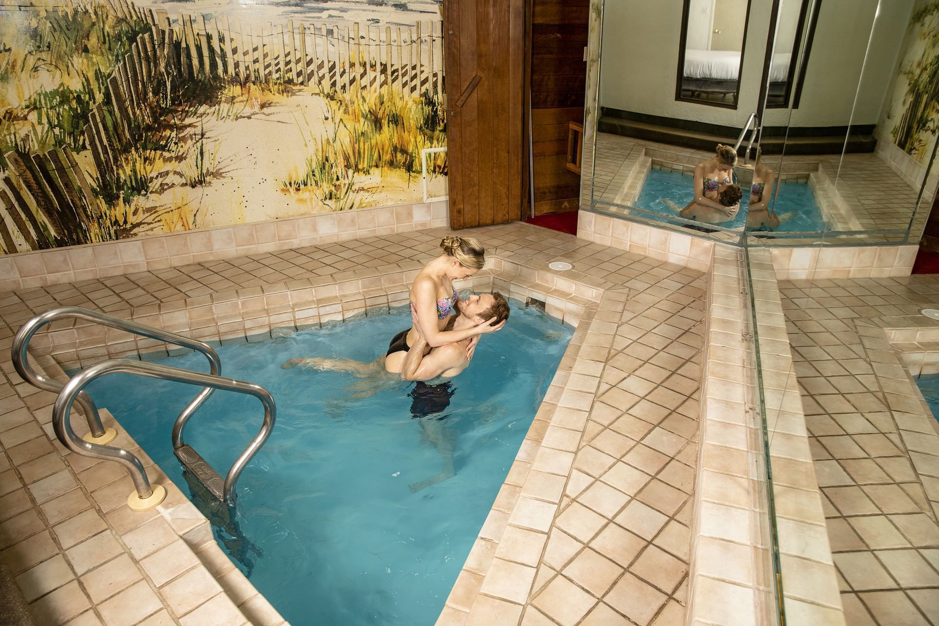 Couple in indoor jacuzzi at Cove Haven Resort