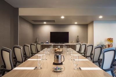 Conference table facing TV in Cape Elizabeth Room highlighting Portland Maine meeting space at Sable Oaks Weddings and Events