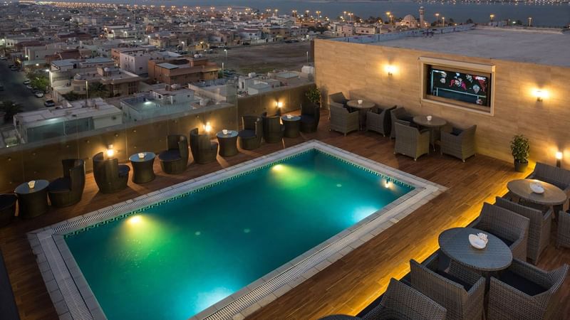 Rooftop pool with city overview at Naviti by Warwick Dammam