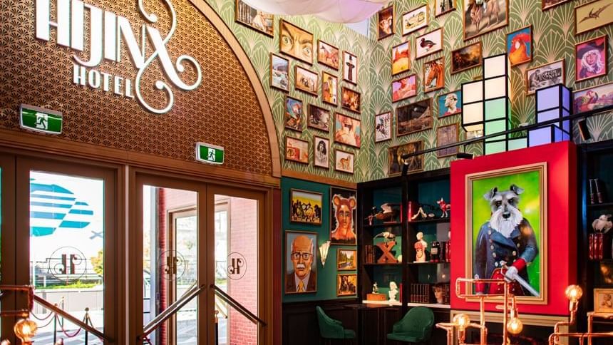 Eclectic lobby of Hijinx Hotel Alexandria with bold art and playful decor near Novotel Sydney International Airport.