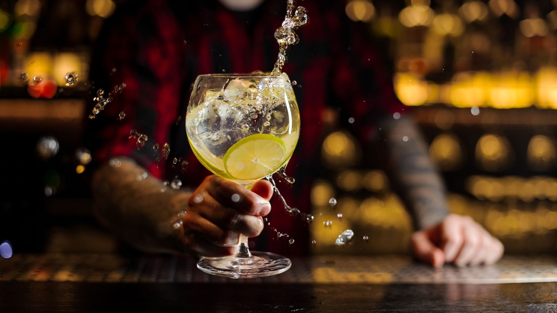 Bartender splashing of a cocktail at Village Hotels Basingstoke