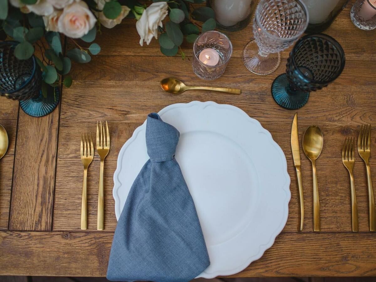 Gold & blue wedding table setting at Live Aqua Beach Resort 
