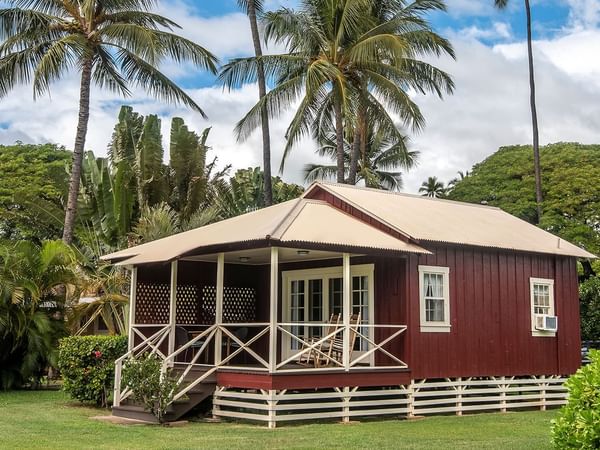 Waimea Plantation Cottage Exterior with mountain and trees