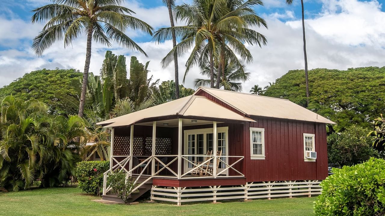 Waimea Plantation Cottage Exterior with mountain and trees