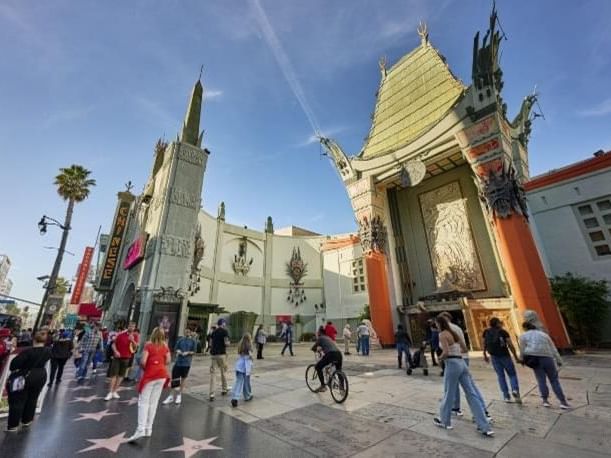 People walking outside the TCL Chinese Theater on Hollywood BLVD in Los Angeles, CA