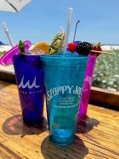Close-up of three vibrant cups with drinks on a table at Bilmar Beach Resort
