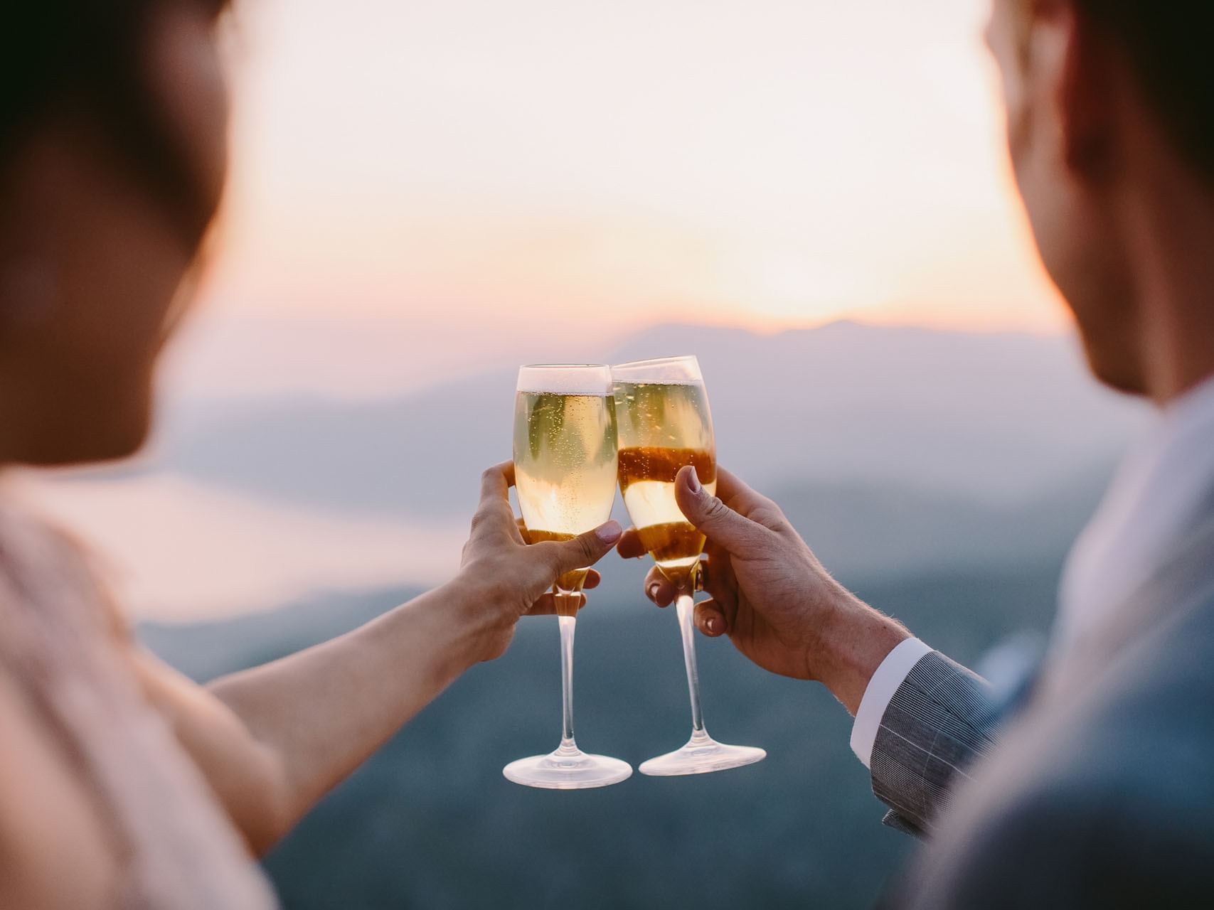 Couple toasting wine glasses at Tanjung Rhu Resort Langkawi