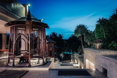 Stairs from the main building to the main pool in the evening at Paradox Resort Phuket
