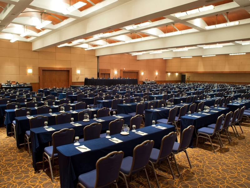 Large conference room at Fiesta Americana, set up with numerous tables and chairs for a professional event