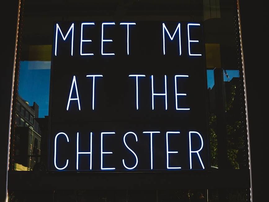 A Meet Me at The Chester neon sign at Gansevoort Hotel