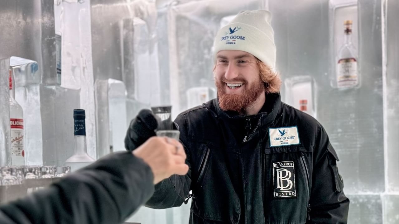 Bartender serving vodka inside the Grey Goose Ice Room