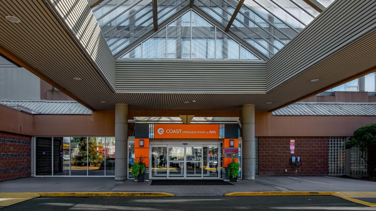 Main entrance at Coast Chilliwack Hotel by APA with hotel signage