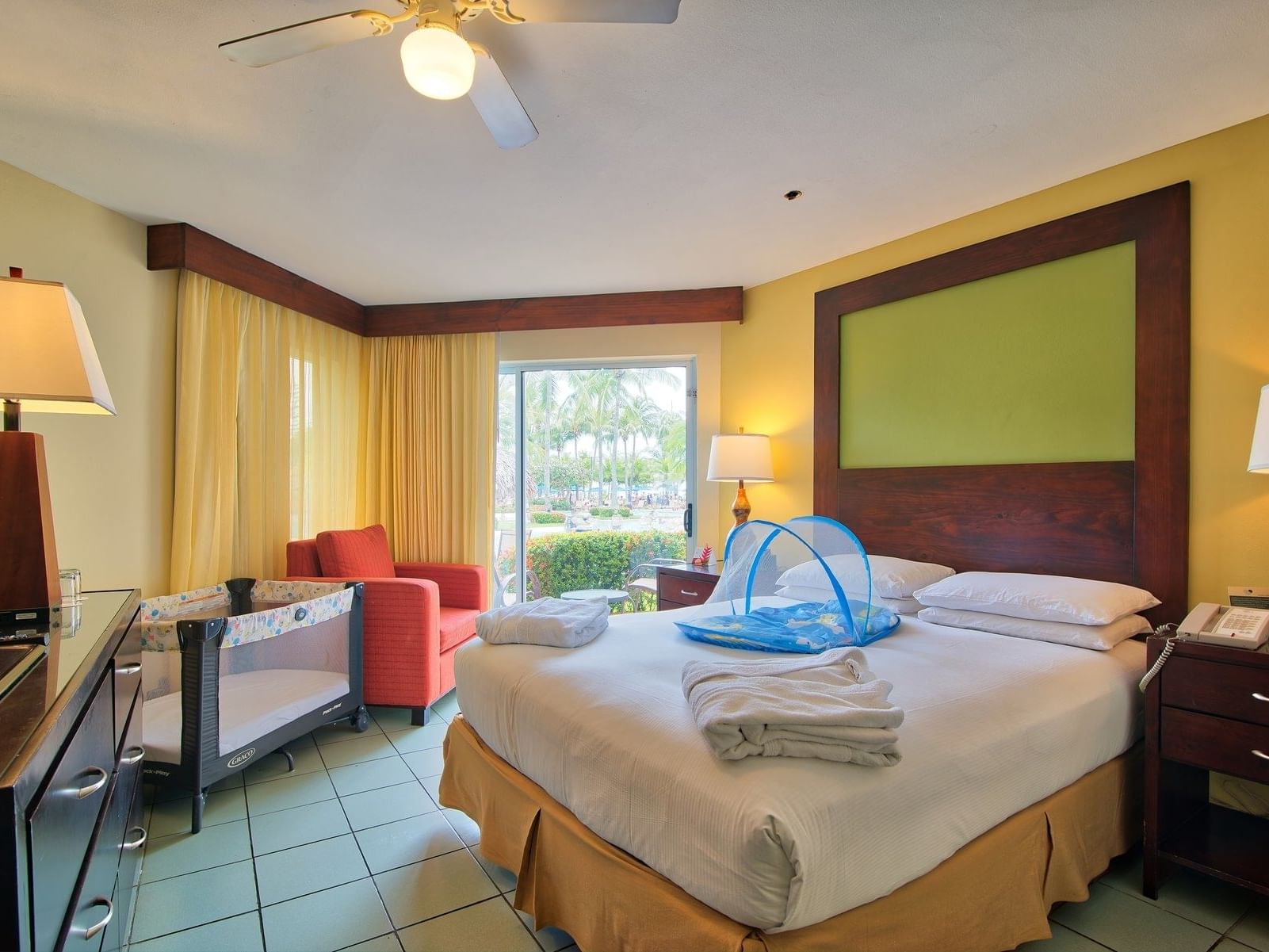 Interior view of Jr Suite Family Room with king  bed at Fiesta Resort