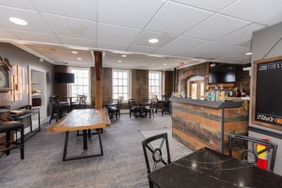 Table set-up with carpeted floors in Savannah Meeting Spaces at River Street Inn