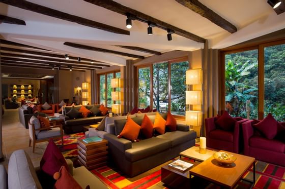 A colorful living room with 4 sets of sofa at Hotel Sumaq