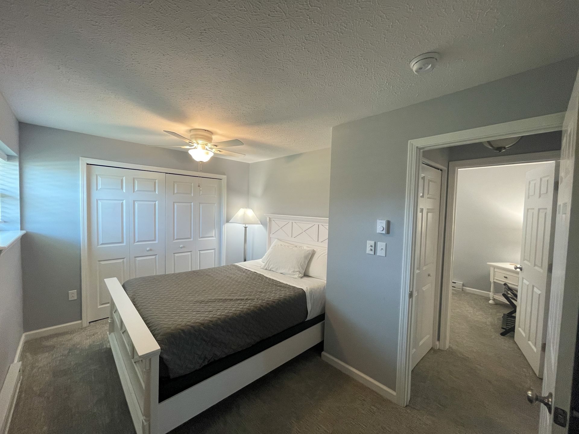 King bed, carpeted floor & doorway in Two bedroom Suite at The Inn at Canaan