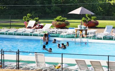 People enjoying in the swimming pool at Honor’s Haven Retreat