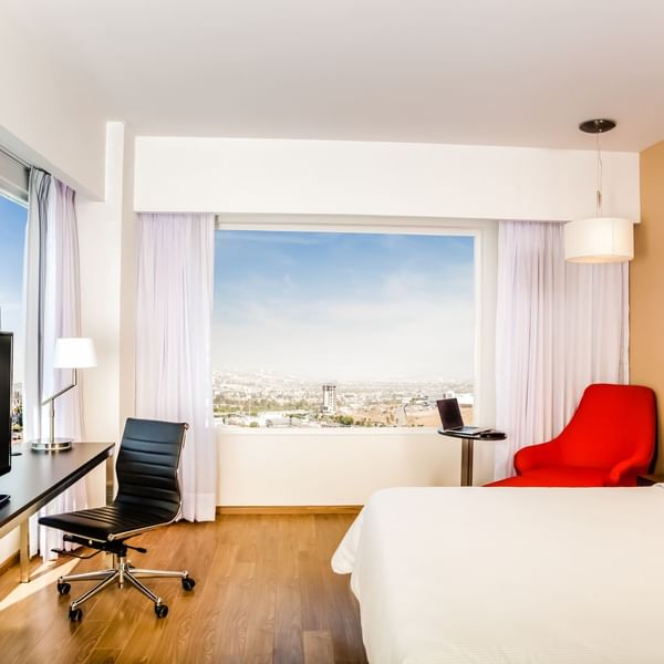 Interior of Superior Room with king bed & TV at Fiesta Inn