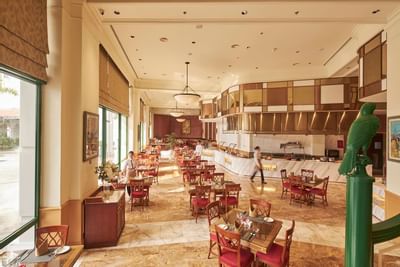 Dining area arranged with tables & chairs at Hanoi Daewoo Hotel
