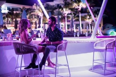 Couple drinking by a Bar counter, The Morgan Resort Spa Village