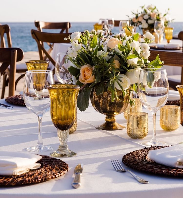 Arranged dining table at the beach at Marquis Los Cabos Resort & Spa
