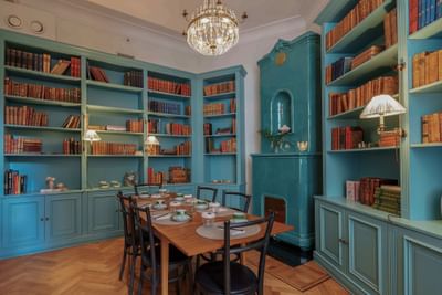 Table by the bookshelves in La Bibliothèque at The Sparrow Hotel