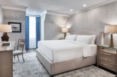 King bed & working table in Unique Suite at Chateau Vaudreuil