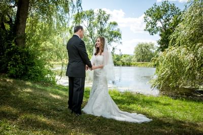 Wedding couple by the lake at La Tourelle Hotel and Spa