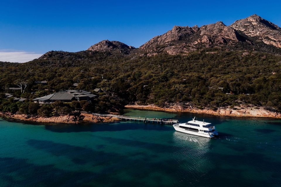 A yacht on the bay near the jetty at Freycinet Lodge
