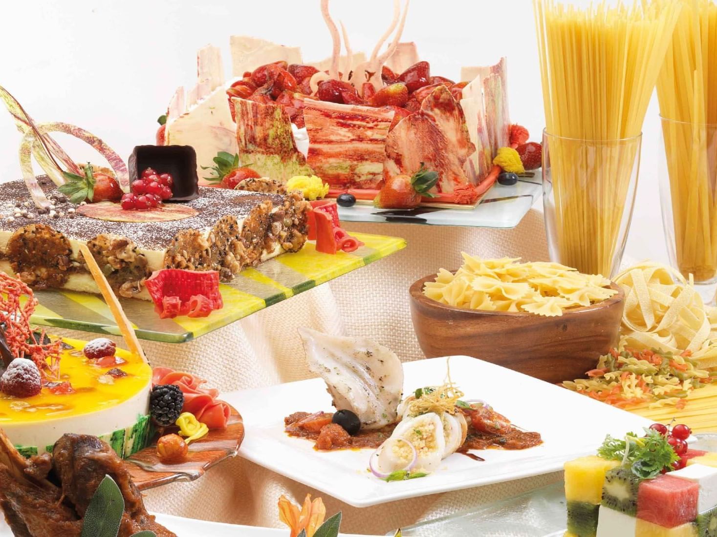 Close-up of a Weekend Hi tea buffet table featuring variety of appetizers & desserts at One World Hotel