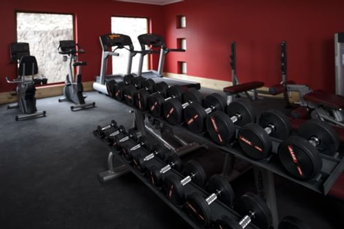 indoor equipped Gym for fitness at NOI Puma Lodge Hotel