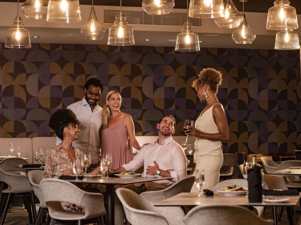 Friends gathered in a table at BoNo Restaurant in Las Casitas Village
