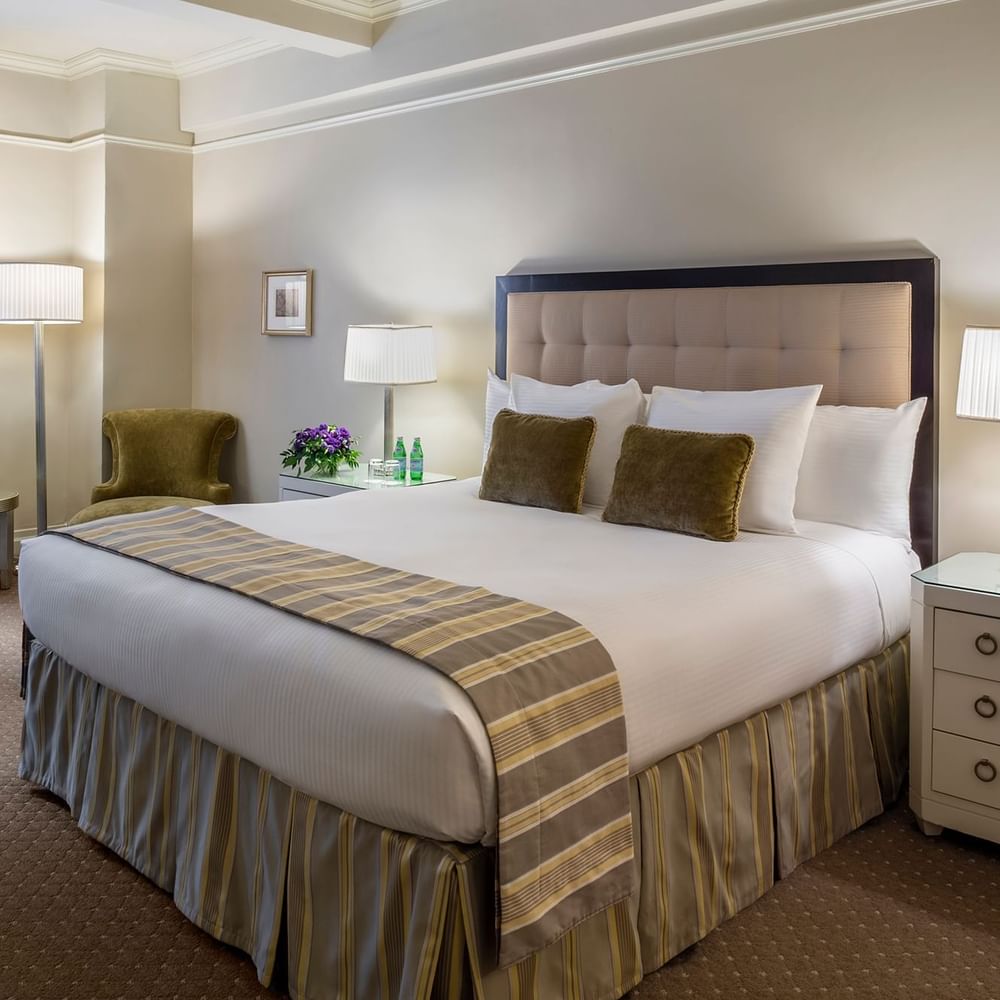 Bed with side tables near window in Accessible Premier City View at Warwick New York