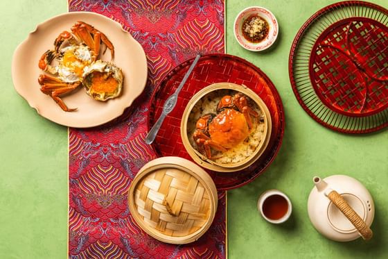 Top-up view of Steamed Crab with Glutinous Rice served in a Bamboo Basket in A La Carte at Goodwood Park Hotel