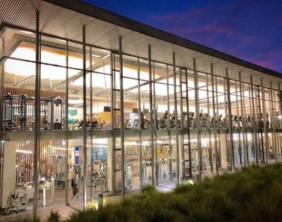 Distant exterior view of the fitness centers with gym equipment at Encore by Mingara