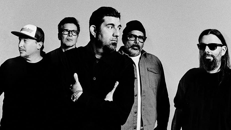 Deftones band members standing together in black and white for an event announcement.