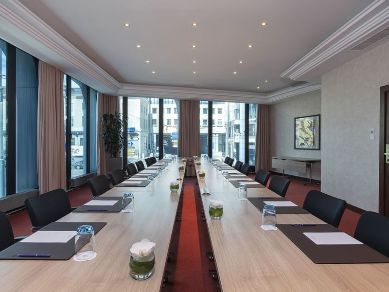 The conference table set up for an event at Warwick Geneva
