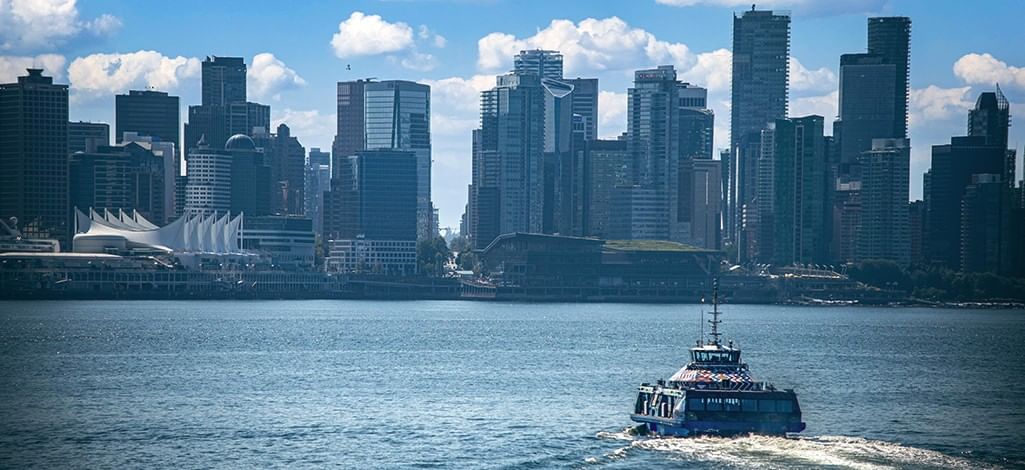 SeaBus traveling across Burrard Inlet toward downtown Vancouver