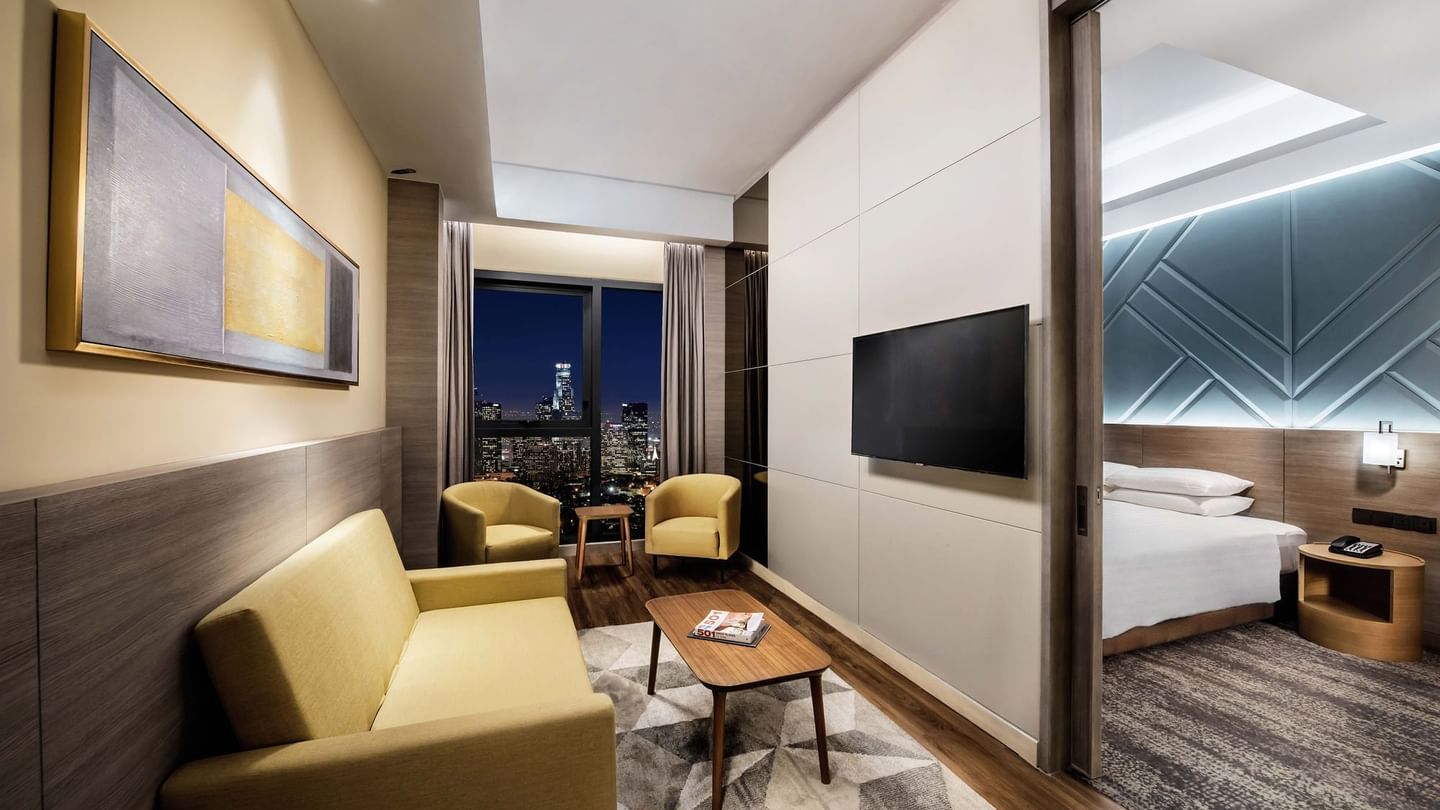 King-size bed and TV in A Basic One Plus King at Sunway Putra Hotel