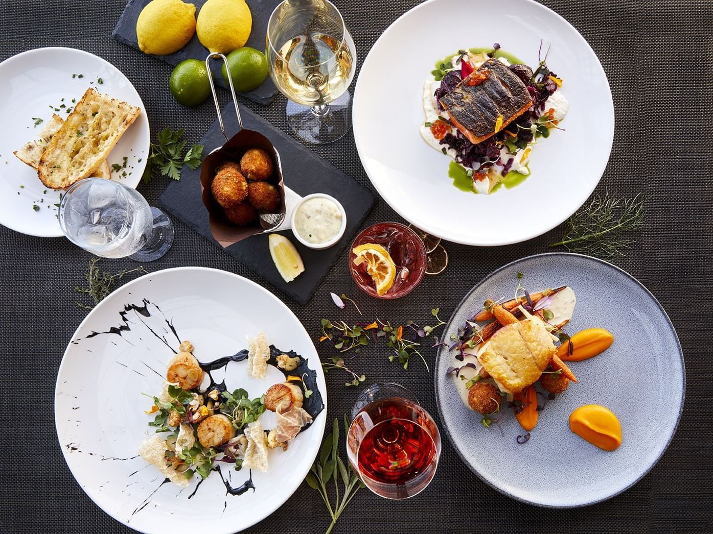 Menu dishes prepared for dining at Granville Island Hotel