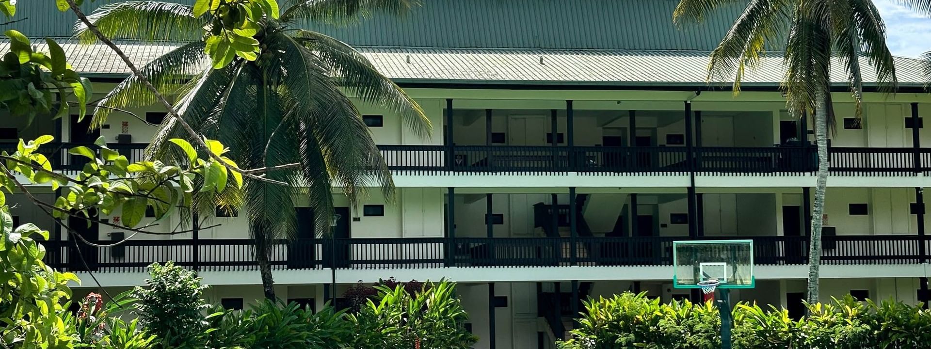 Green sports court with a basketball hoop at The Naviti Resort in Korolevu