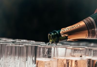 Barman pouring Alcohol drinks into the glasses at Paradox Hotel