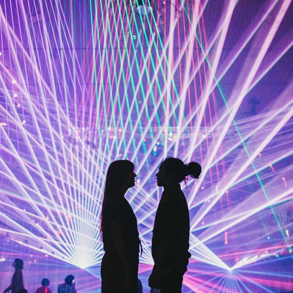 Mona Foma Festival, Two people with a backdrop of purple lighting near Hotel Grand Chancellor Hobart