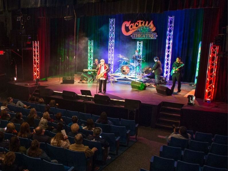 A band performing at Cactus Theater near MCM Hotel Lubbock