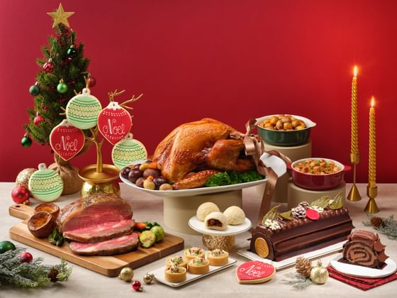 A full festive feast spread with roast turkey prime rib and a Goodwood Park Hotel chocolate Yule Log cake