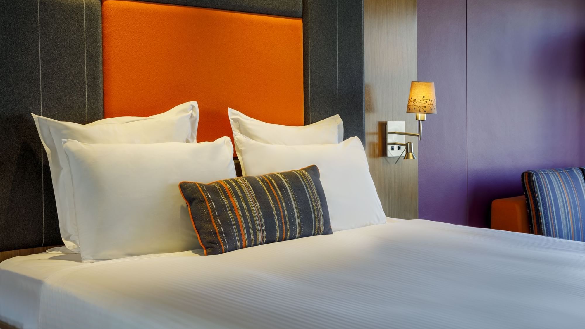 Comfy bed with a cushioned headboard in Classic Room at Pullman Sydney Hyde Park