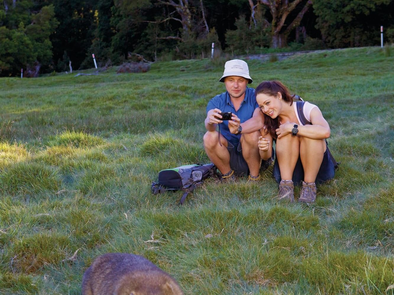 Couple relaxing in national park near Cradle Mountain Hotel